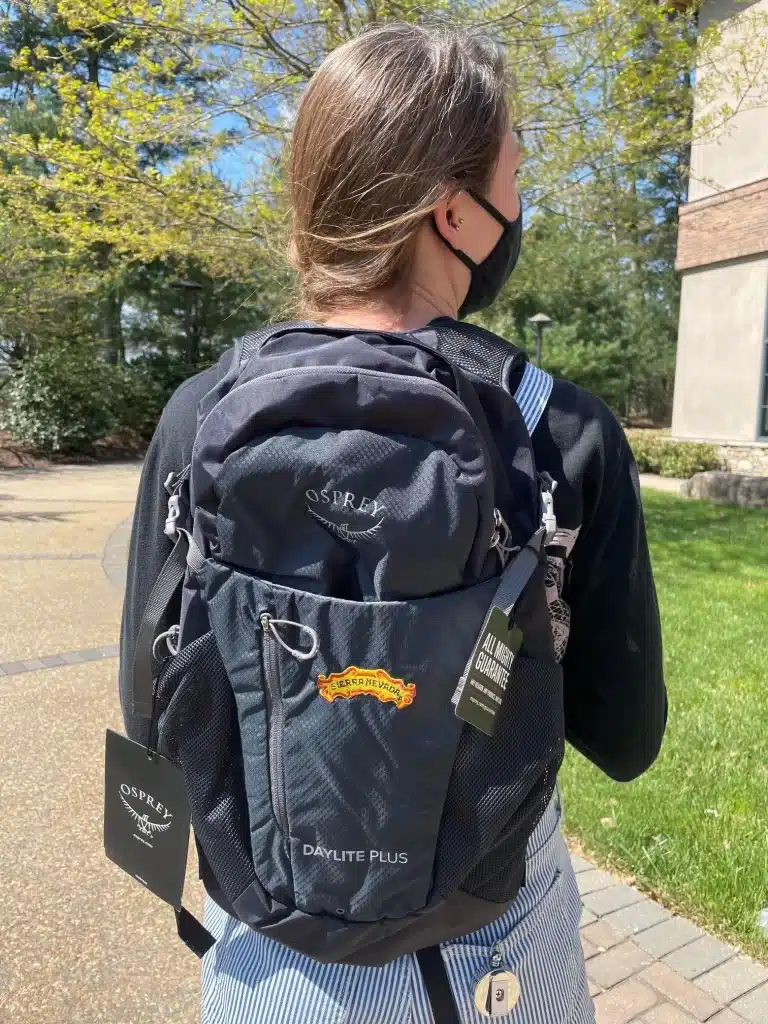 a woman carrying a Osprey Daylite Plus Daypack