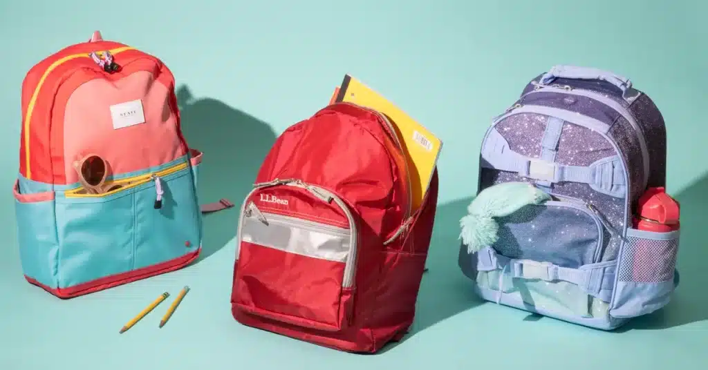 3 different kids school backpacks with different colors 