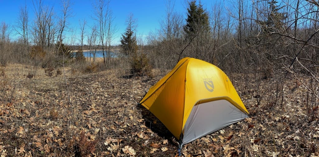 a yellow Nemo Hornet Elite backpack tent