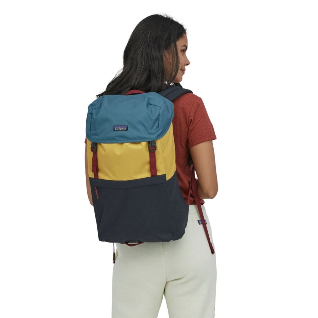 a girl carrying a Patagonia Arbor Grande Backpack