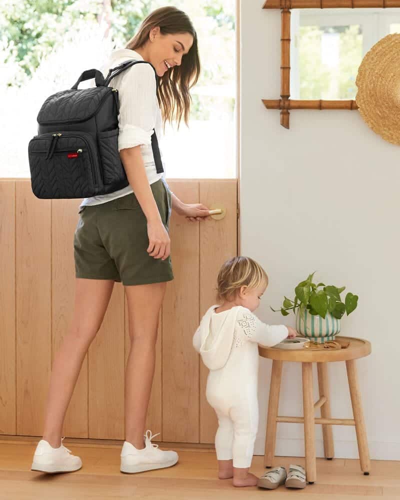 mom and a toddler with Skip Hop Forma Diaper Backpack