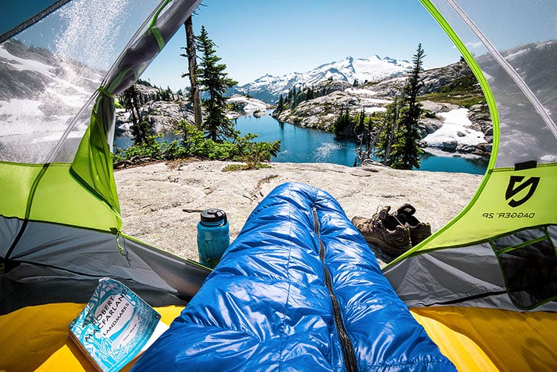 a view outside a sleeping tent showing scenery 