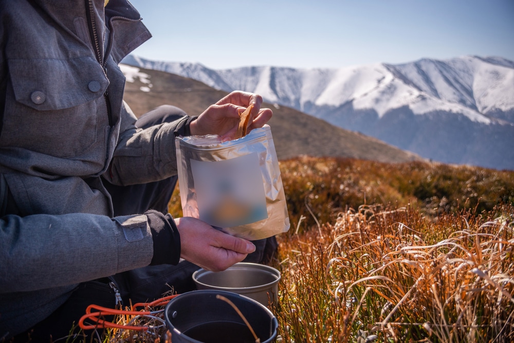 Tourist Is Eating Freeze Dried Food During Resting Enjoy A