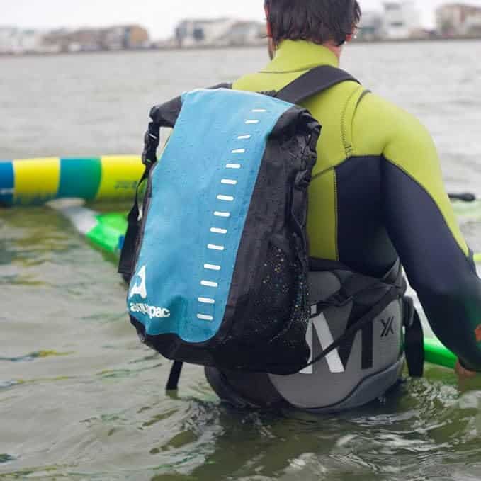 a man submerged in water an wearing Aquapac Toccoa Waterproof Daysack  