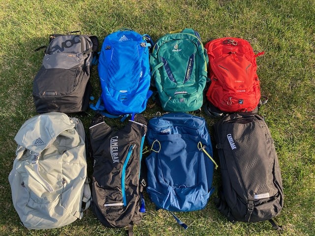 hydration packs lying on the grass