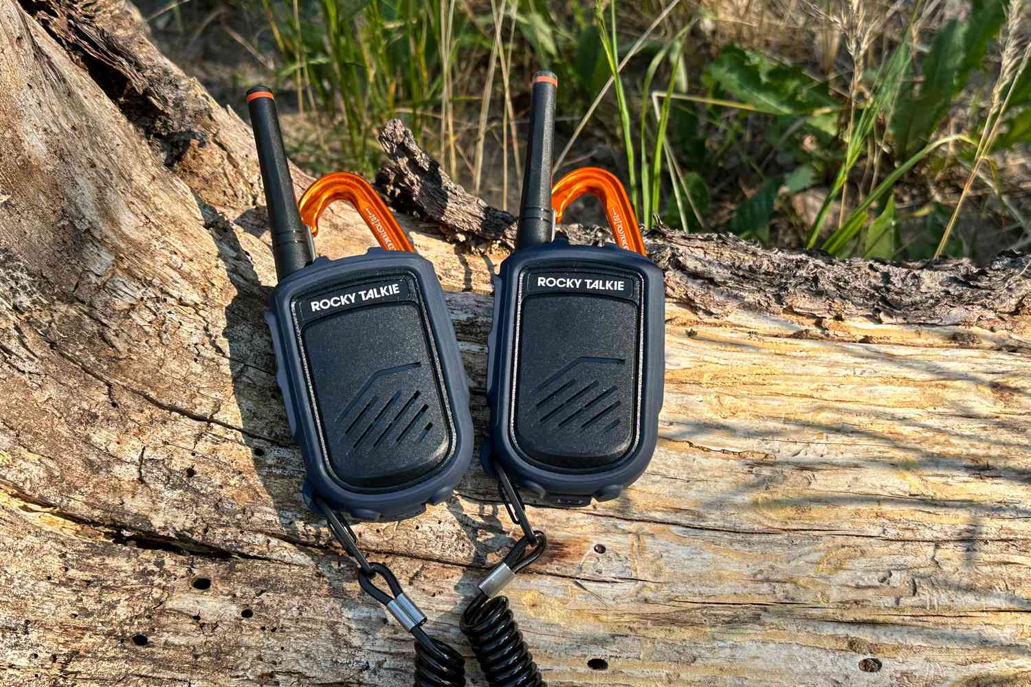 walkie talkies on a wood log walkie talkies on a wood log