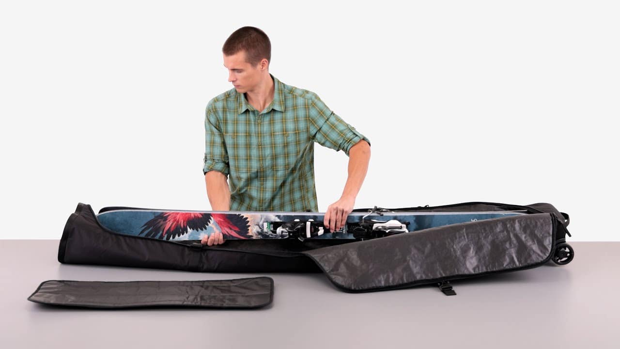 a boy organizing thule ski bag a boy organizing thule ski bag