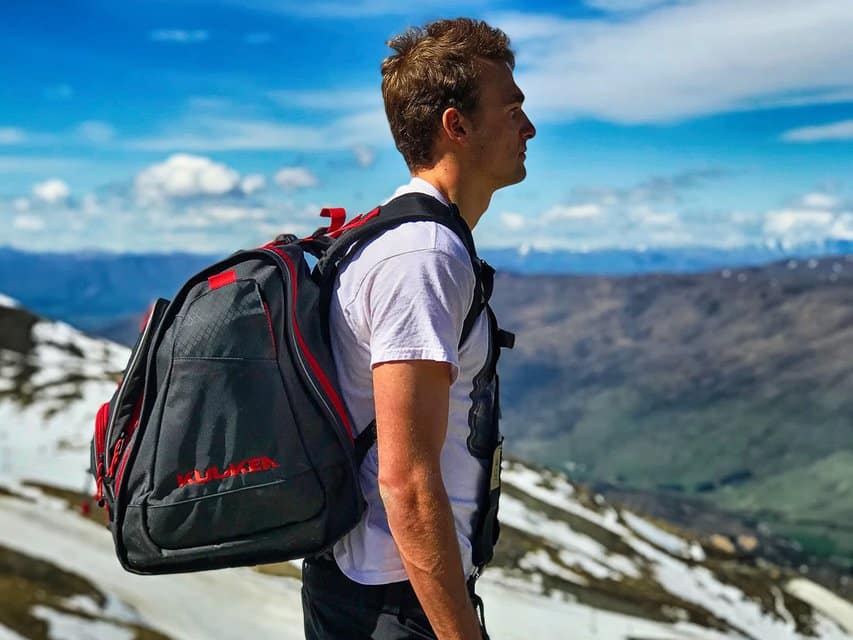 a boy wearing kulkea boot bag