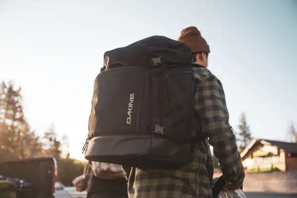 back of a person wearing dakine boot bag
