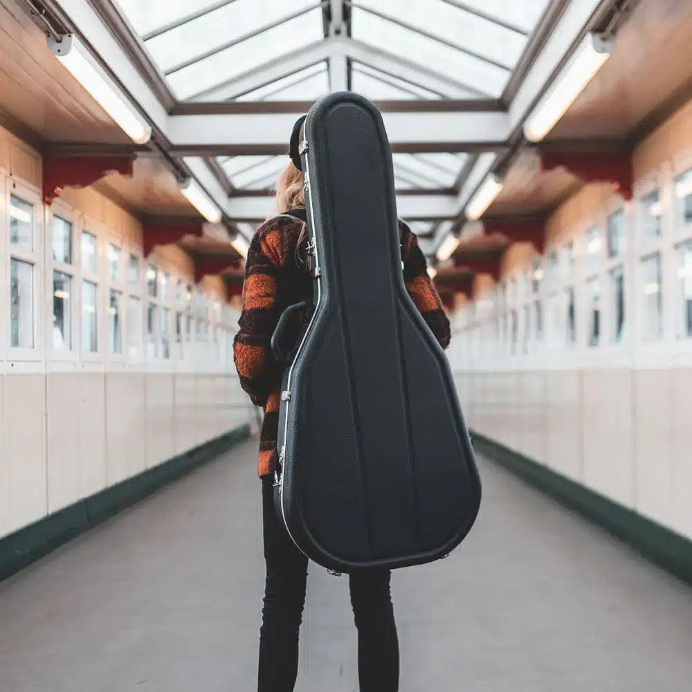 back of a girl wearing Hard Shell Guitar Backpack