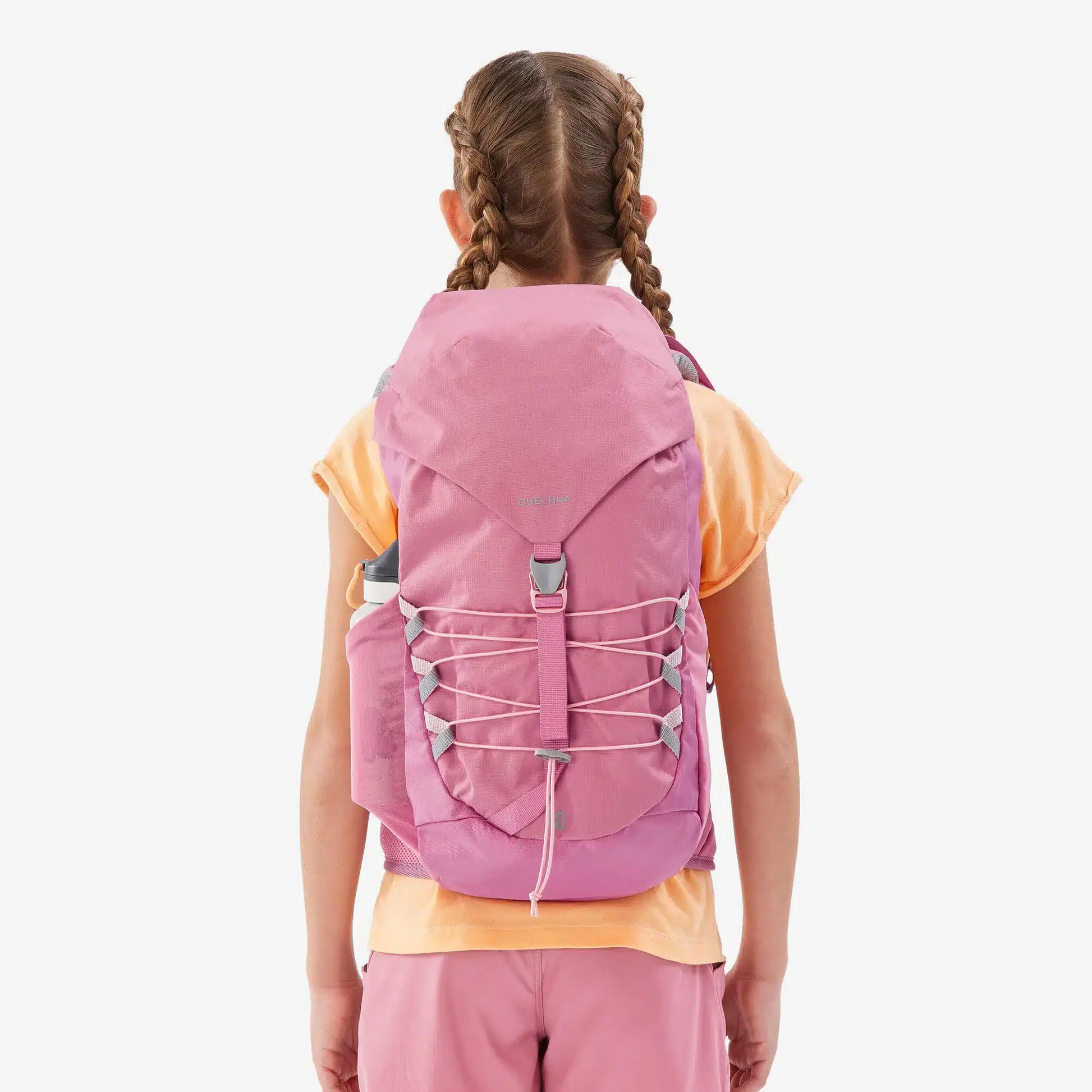 back of a girl with braids wearing pink colored Decathlon MH bag